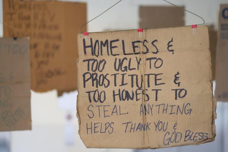 Willie Baronet, an artist and professor, purchased signs from the homeless people that they used to pander for money and turned them into a hanging art instillation. Willie Baronet, an artist and professor, purchased signs from the homeless people that they used to pander for money and turned them into a hanging art instillation.